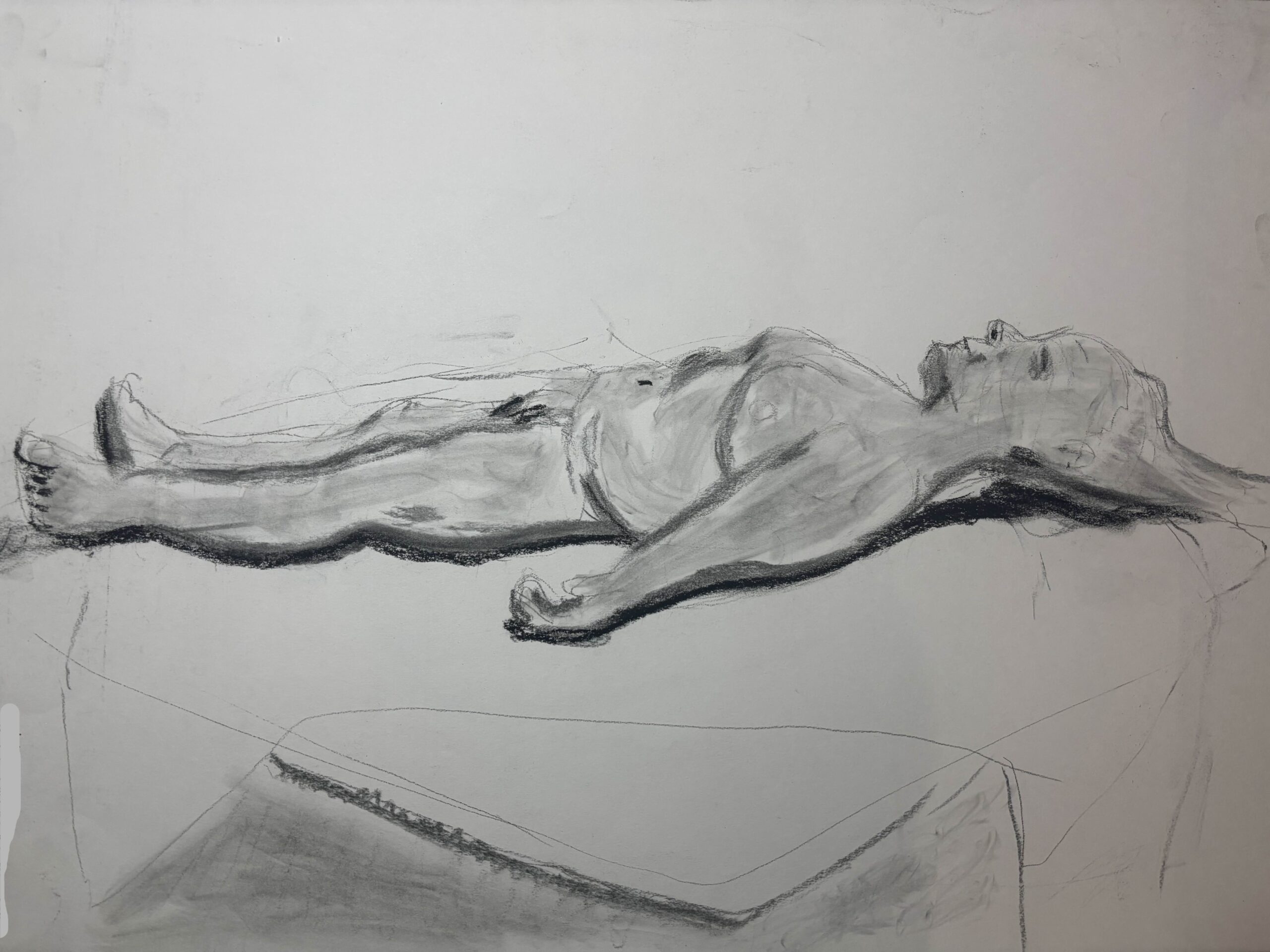 A drawing of a woman lying on her back face up as seen from the side.